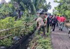 Personel Kodim 1402/Polman Bersama Warga Bersihkan Drainase di Kelurahan Madatte