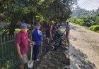 Babinsa Koramil 1402-02/Wonomulyo Bersama Warga Kerja Bakti Bersihkan Drainase